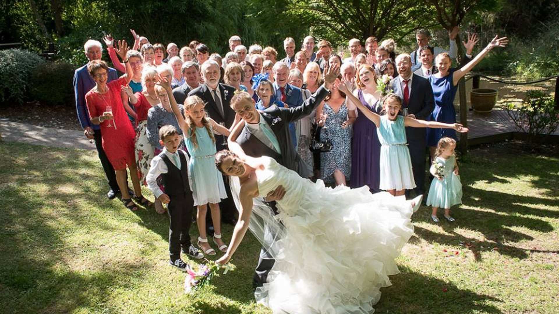 Wedding guests celebrating outside The Playhouse Café & Theatre wedding venue in Māpua, Nelson NZ